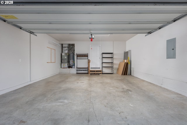 garage featuring electric panel, gas water heater, and a garage door opener