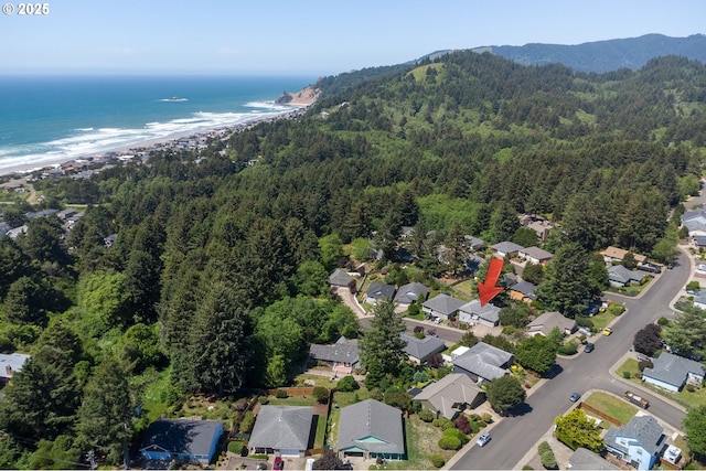 birds eye view of property with a residential view, a forest view, and a water view