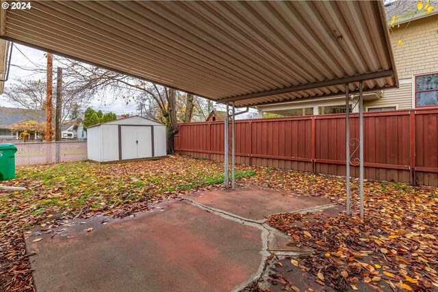 view of patio featuring a storage shed