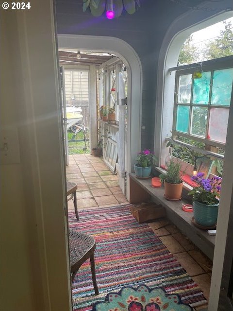 corridor with light tile patterned floors