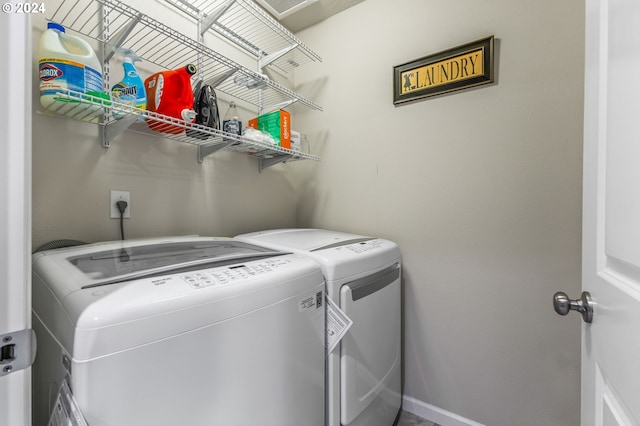 laundry area featuring washing machine and clothes dryer