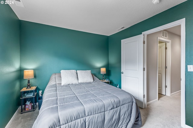 bedroom featuring light colored carpet