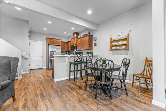 dining area with light hardwood / wood-style floors