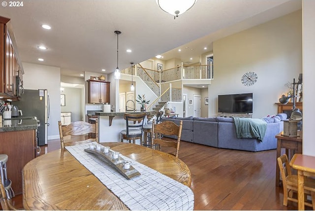 dining room with dark hardwood / wood-style flooring