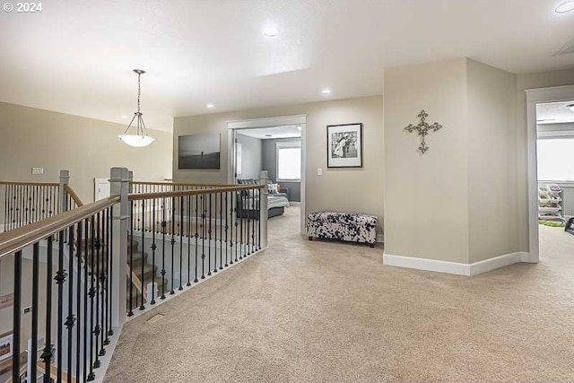 hallway featuring carpet flooring