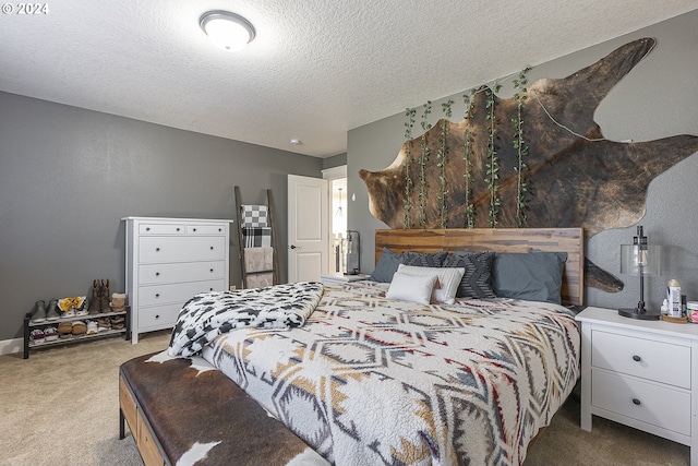 carpeted bedroom with a textured ceiling