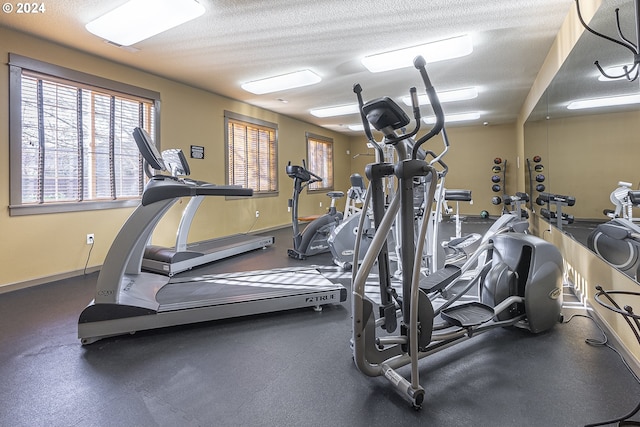 gym featuring a textured ceiling