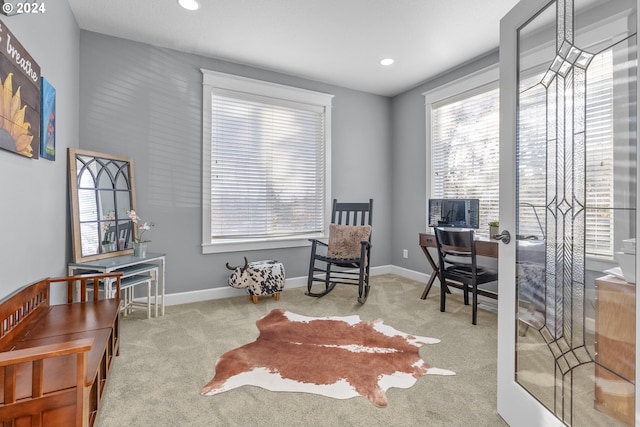 office area featuring light carpet