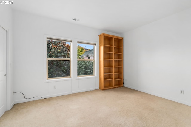 empty room with light colored carpet