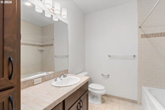 full bathroom featuring toilet, tiled shower / bath combo, vanity, and tile patterned floors