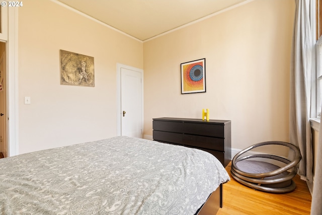 bedroom with hardwood / wood-style flooring