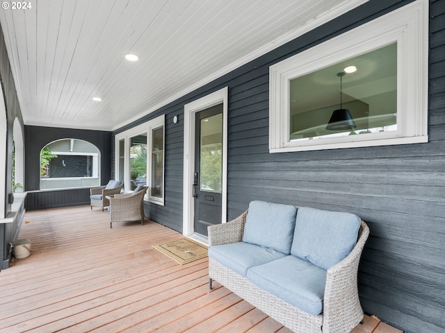 wooden deck featuring outdoor lounge area