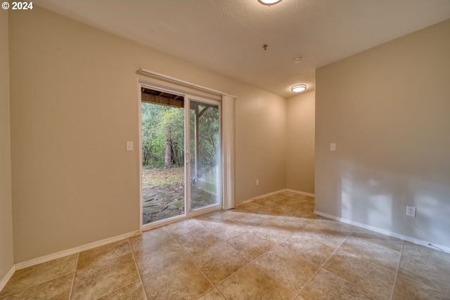 empty room with a textured ceiling