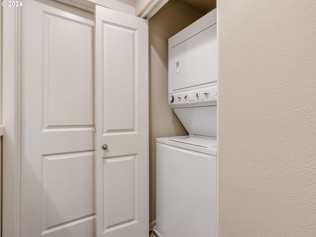 laundry area featuring stacked washer and dryer