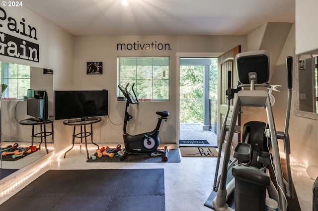 workout room featuring concrete flooring