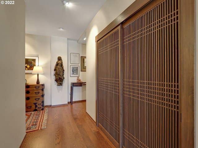 hallway featuring hardwood / wood-style flooring