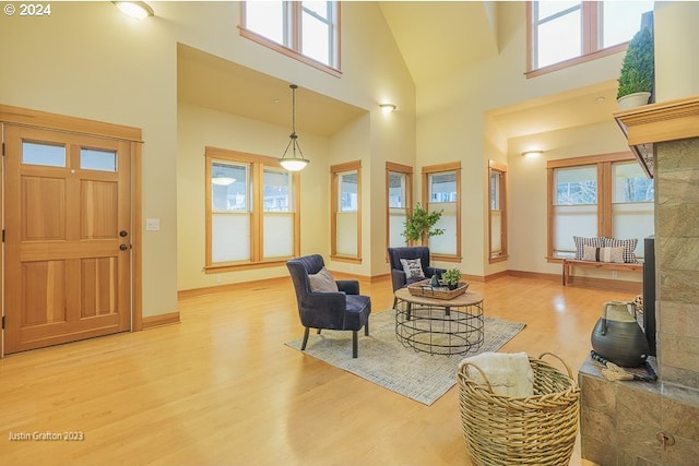 285 23rd St, Astoria, OR 97103 - foyer entrance with light wood-type flooring, a towering ceiling, and baseboards