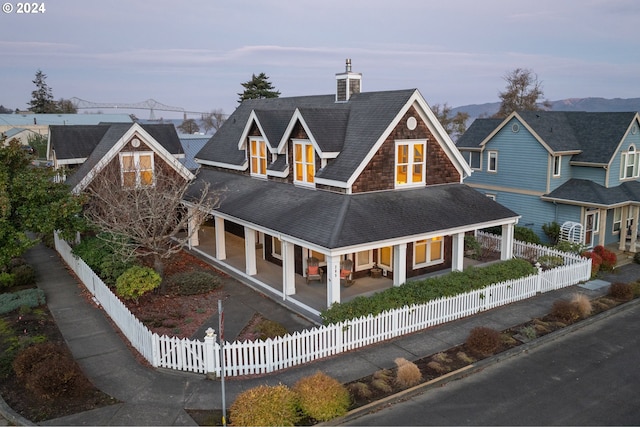 view of front of house with a mountain view and covered porch