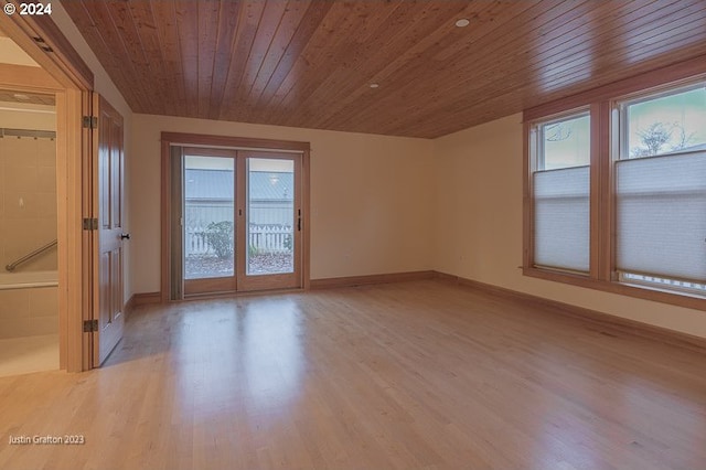 285 23rd St, Astoria, OR 97103 - spare room with wood ceiling, light wood-style flooring, and baseboards