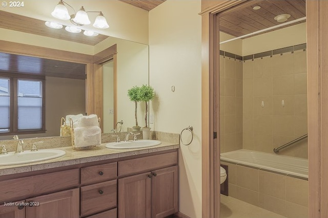 285 23rd St, Astoria, OR 97103 - full bath with double vanity, toilet, and tiled shower / bath