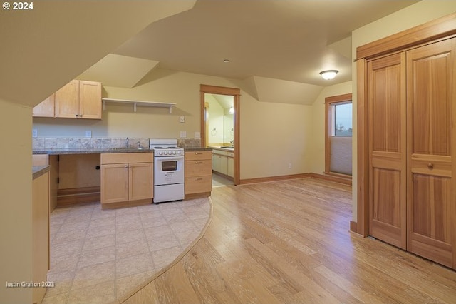 285 23rd St, Astoria, OR 97103 - kitchen featuring white range with electric stovetop, vaulted ceiling, light brown cabinets, a sink, and open shelves