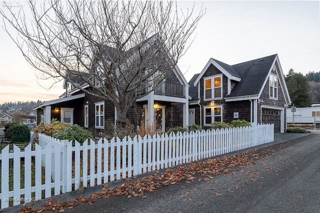 285 23rd St, Astoria, OR 97103 - shingle-style home with a garage, a fenced front yard, and a balcony