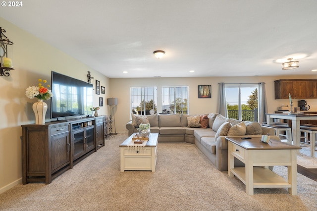 carpeted living room featuring a healthy amount of sunlight