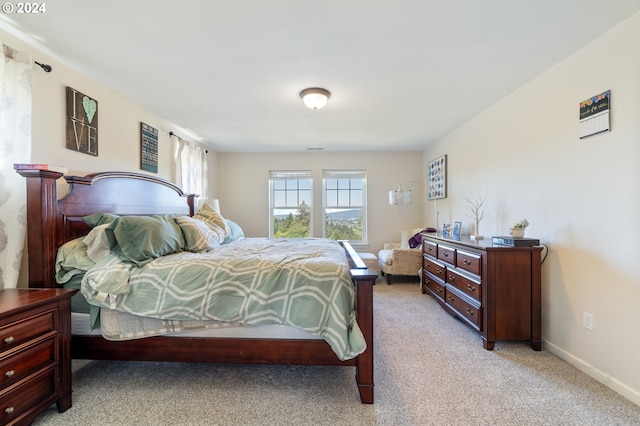 bedroom with light colored carpet