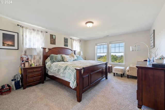 bedroom with light colored carpet