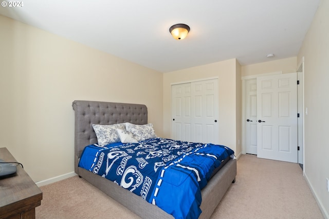 bedroom with carpet floors and a closet