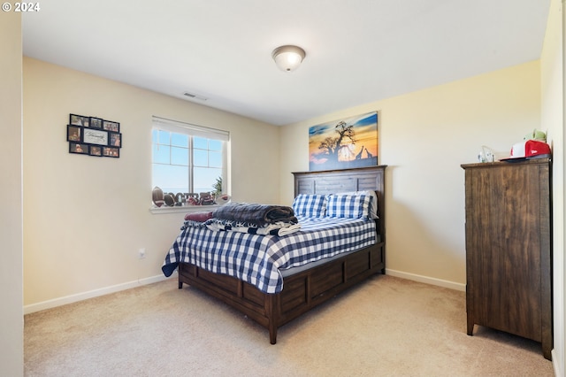 bedroom with light carpet