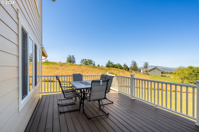 wooden deck with a yard