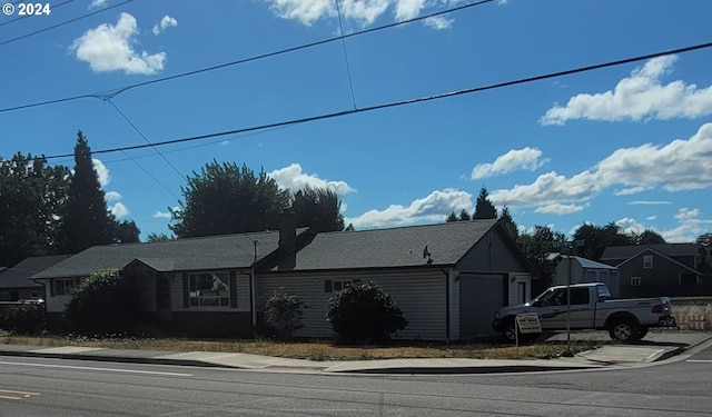 view of front of property with a residential view and an attached garage