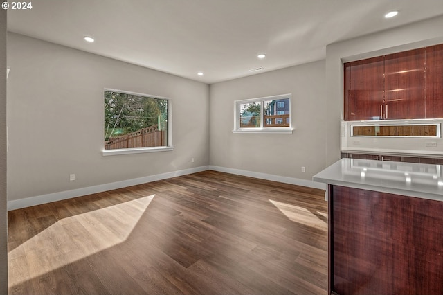 unfurnished dining area featuring light wood-type flooring