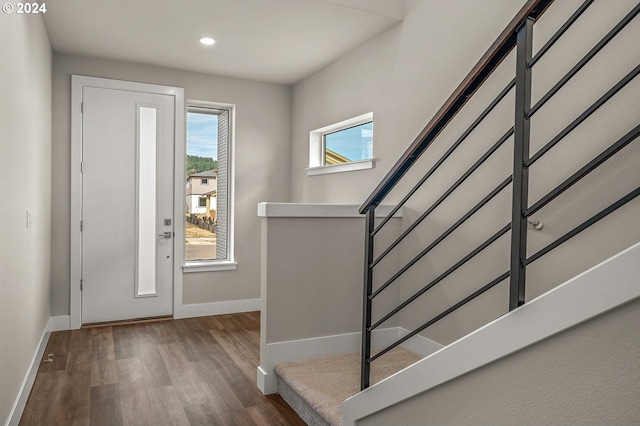 entryway with dark hardwood / wood-style floors