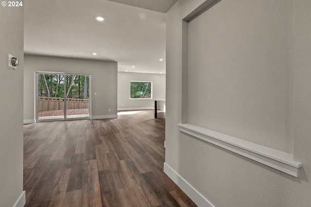 corridor featuring dark hardwood / wood-style floors