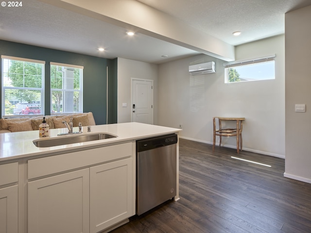 kitchen featuring dishwasher, white cabinets, a healthy amount of sunlight, and sink