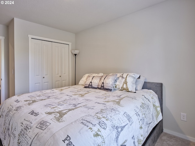 carpeted bedroom with a closet