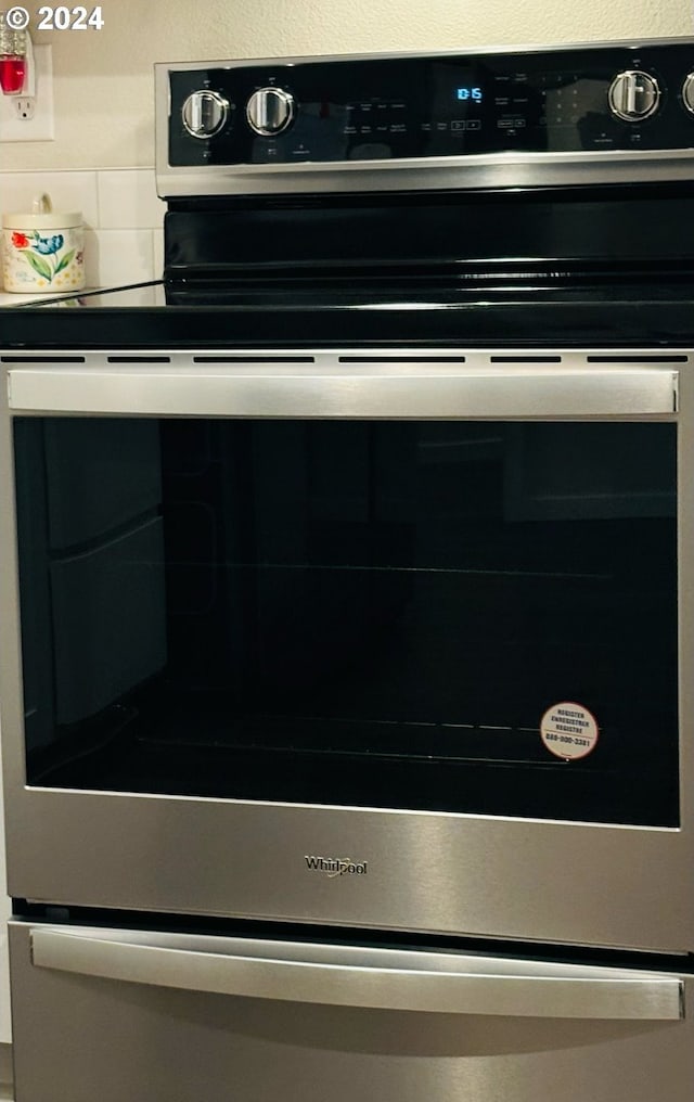 interior details featuring stainless steel electric range