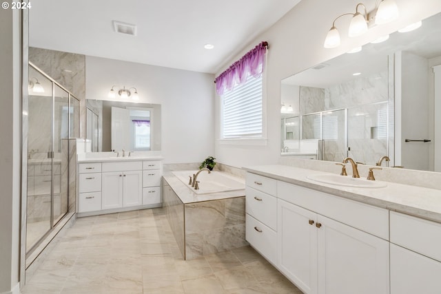 bathroom featuring independent shower and bath and vanity