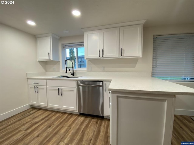 kitchen with white cabinets, dishwasher, and light hardwood / wood-style flooring