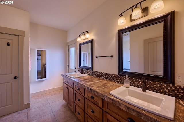 bathroom with vanity, backsplash, and tile patterned floors