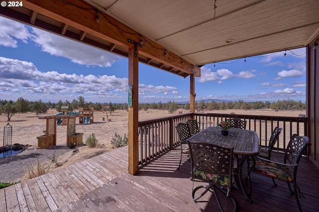 wooden terrace featuring a rural view