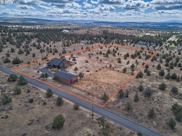 drone / aerial view featuring a mountain view