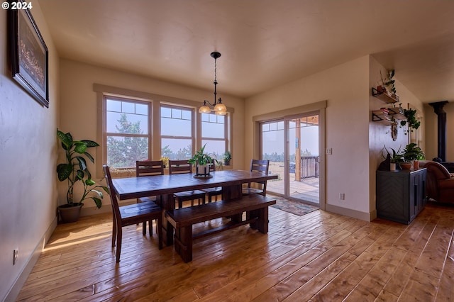 dining room featuring light hardwood / wood-style flooring and an inviting chandelier