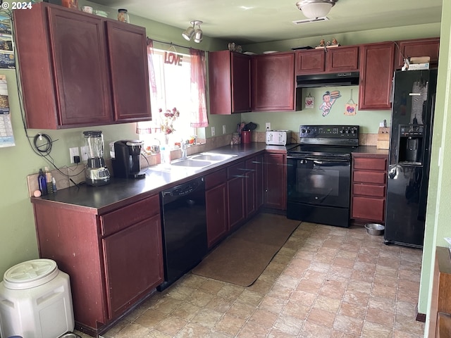 kitchen with sink and black appliances