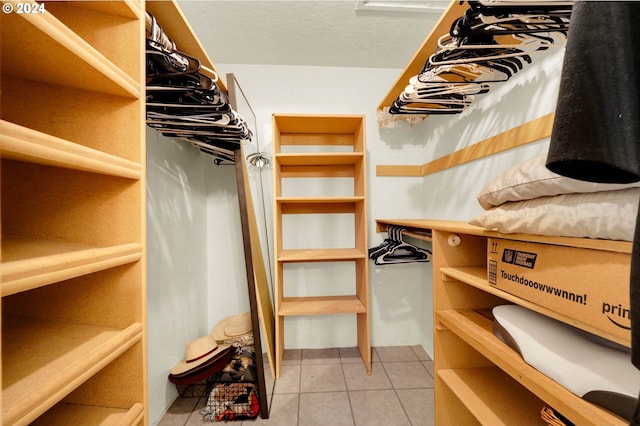 walk in closet featuring light tile patterned floors