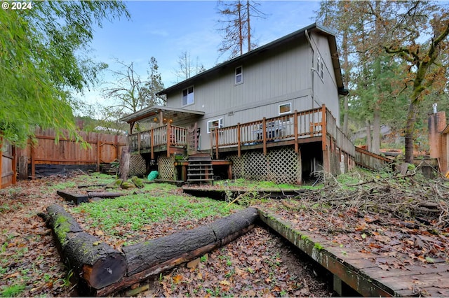 back of property with a wooden deck