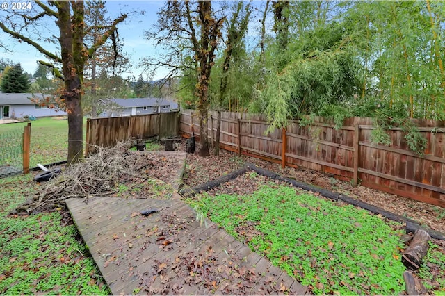 view of yard with a wooden deck