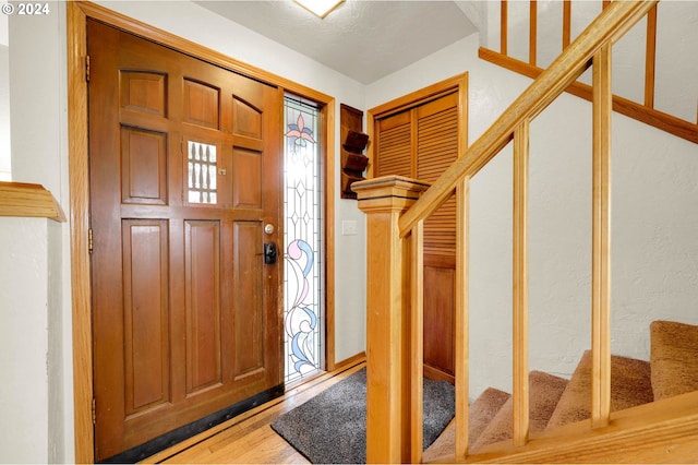 foyer entrance with hardwood / wood-style floors